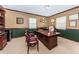 Professional home office with classic furniture, built-in shelving, and ample workspace at 6406 Congress St, New Port Richey, FL 34653