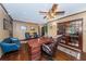Well-appointed home office with hardwood floors, wood trim, and classic furnishings at 6406 Congress St, New Port Richey, FL 34653