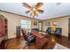Spacious office featuring a large desk, hardwood floors, and comfortable seating area at 6406 Congress St, New Port Richey, FL 34653