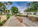 Beautiful park featuring benches, trees, landscaping, and a walking path along a waterfront at 6406 Congress St, New Port Richey, FL 34653