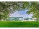 Scenic view of a public park with green grass, mature trees, and covered pavilions at 6406 Congress St, New Port Richey, FL 34653