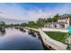 Beautiful waterfront view featuring a river, park, and building with a tower with the city's name on it at 6406 Congress St, New Port Richey, FL 34653
