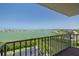 Breathtaking balcony view showcasing sparkling waterfront, lush greenery, and vibrant cityscape at 7050 Sunset S Dr # 1401, South Pasadena, FL 33707