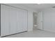 The bedroom features a large closet and doorway that shows into the neutral-toned living area at 7050 Sunset S Dr # 1401, South Pasadena, FL 33707