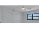This bedroom has a ceiling fan, a window, and a view at 7050 Sunset S Dr # 1401, South Pasadena, FL 33707