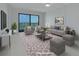 Relaxing living room with comfortable seating, stylish decor, and a view of the water at 7050 Sunset S Dr # 1401, South Pasadena, FL 33707