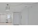 The living room is bright with modern lighting and neutral tones, next to an updated kitchen area at 7050 Sunset S Dr # 1401, South Pasadena, FL 33707
