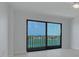 This room has a ceiling fan, modern flooring, and access to a private balcony at 7050 Sunset S Dr # 1401, South Pasadena, FL 33707