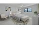 Bright main bedroom with neutral tones, a comfortable bed, and modern furnishings at 7050 Sunset S Dr # 1401, South Pasadena, FL 33707