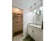 Bathroom with granite countertops, pendant lighting, and glass shower door at 7360 Ulmerton Rd # 16A, Largo, FL 33771