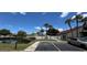Scenic community featuring a pond, lush landscaping, and various amenities at 7360 Ulmerton Rd # 16A, Largo, FL 33771