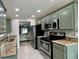 Well-maintained kitchen with stainless steel appliances and ample counter space at 7360 Ulmerton Rd # 16A, Largo, FL 33771
