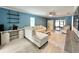 Bright living room features comfortable seating, ceiling fan and sliding doors to the lanai at 7360 Ulmerton Rd # 16A, Largo, FL 33771