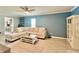 Cozy living room with neutral tones, a ceiling fan and lots of natural light at 7360 Ulmerton Rd # 16A, Largo, FL 33771