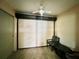 Home boasts covered screened patio with fan and roll down blind at 7360 Ulmerton Rd # 16A, Largo, FL 33771