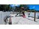 Fun community playground offers swings, a slide, and a wooden play structure for , set on a sandy surface at 7360 Ulmerton Rd # 16A, Largo, FL 33771