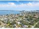 Aerial view of a waterfront community showcasing multiple canals and waterways leading to the Gulf of Mexico at 75 New Jersey Dr, Dunedin, FL 34698