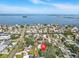Aerial view showcases the property located close to the water at 75 New Jersey Dr, Dunedin, FL 34698
