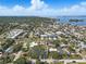 An aerial view emphasizes the property's location within a picturesque coastal community at 75 New Jersey Dr, Dunedin, FL 34698