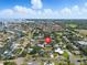 An aerial view displays the property's convenient proximity to community amenities, water, and golf at 75 New Jersey Dr, Dunedin, FL 34698