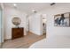 Bright hallway with hardwood floors leading to bedroom and bathroom with a clean, modern design at 75 New Jersey Dr, Dunedin, FL 34698
