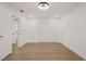A bright bedroom with wood floors, a closet, and recessed lighting creates a clean and modern aesthetic at 75 New Jersey Dr, Dunedin, FL 34698