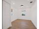 A light-filled bedroom showcases clean, white walls, wood floors, and contemporary design elements at 75 New Jersey Dr, Dunedin, FL 34698