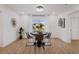Bright dining room with a round table and views of the backyard at 75 New Jersey Dr, Dunedin, FL 34698