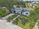 Charming home with a well-manicured lawn and a welcoming pathway leading to the entrance at 75 New Jersey Dr, Dunedin, FL 34698