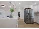 Bright, airy kitchen featuring stainless steel appliances, a quartz countertop island, and modern pendant lights at 75 New Jersey Dr, Dunedin, FL 34698