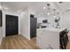 Modern kitchen with stainless steel appliances, a quartz countertop island, and elegant pendant lighting at 75 New Jersey Dr, Dunedin, FL 34698