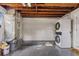 Laundry area with a stacked washer and dryer set for efficient home convenience at 75 New Jersey Dr, Dunedin, FL 34698