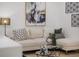Comfortable living room featuring a modern couch with decorative pillows at 75 New Jersey Dr, Dunedin, FL 34698