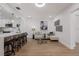 Open-concept living room with modern furnishings and access to the kitchen at 75 New Jersey Dr, Dunedin, FL 34698