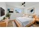Relaxing bedroom with a cozy bed, modern decor, and ample natural light at 8418 Westridge Dr, Tampa, FL 33615