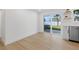 Open dining area with sliding glass doors to the backyard and modern fixtures at 8418 Westridge Dr, Tampa, FL 33615