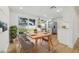 Bright dining area featuring modern table and chairs, adjacent to the kitchen with stainless steel appliances at 8418 Westridge Dr, Tampa, FL 33615
