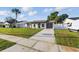 Beautiful single-story home with a well-maintained lawn and a cozy, inviting front porch at 8418 Westridge Dr, Tampa, FL 33615