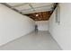 Clean, freshly painted garage, providing ample space for parking and storage with updated electrical panel and water heater at 8418 Westridge Dr, Tampa, FL 33615