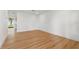 Spacious living room area with wood flooring; bright and airy feel at 8418 Westridge Dr, Tampa, FL 33615
