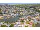 This aerial view shows houses nestled along canals, each with its own dock and boat at 8711 Thornwood Ln, Tampa, FL 33615