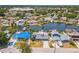 This aerial shows a quiet neighborhood by the water with multiple boat docks and swimming pools at 8711 Thornwood Ln, Tampa, FL 33615