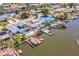 Waterfront homes with boat docks and pools, highlighting the real estate and desirable neighborhood at 8711 Thornwood Ln, Tampa, FL 33615