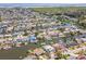 Birds eye view showcases the serene waterfront neighborhood, with many properties on the canals at 8711 Thornwood Ln, Tampa, FL 33615