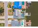 An aerial view showing the house, swimming pool, and boat dock along the canal at 8711 Thornwood Ln, Tampa, FL 33615