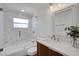 Modern bathroom with marble tiled shower, sleek vanity, and contemporary fixtures at 8711 Thornwood Ln, Tampa, FL 33615