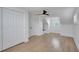 Bedroom with hardwood flooring, bright white walls, and attic window at 8711 Thornwood Ln, Tampa, FL 33615