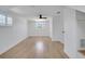 Bedroom featuring hardwood flooring, bright white walls, and shuttered windows at 8711 Thornwood Ln, Tampa, FL 33615