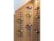 Stylish wood accent wall features built-in wine rack and modern decor at 8711 Thornwood Ln, Tampa, FL 33615