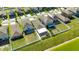 Aerial view of homes with fenced backyards and a screened-in lanai at 872 Olive Conch St, Ruskin, FL 33570